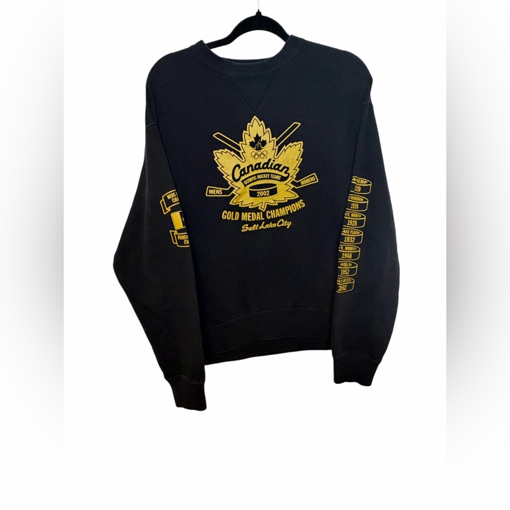 Roots Black Crewneck with Gold Graphics